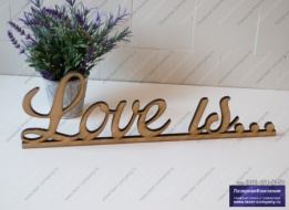 Надпись 'Love is...' курсивом из дерева
